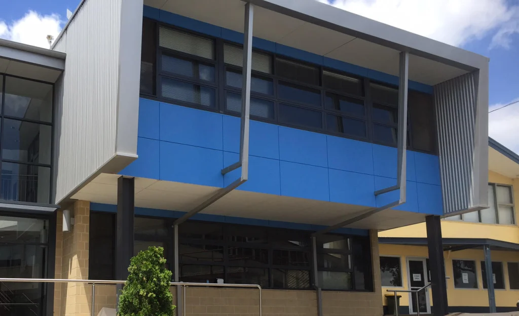 Two-storey facade with blue feature panels