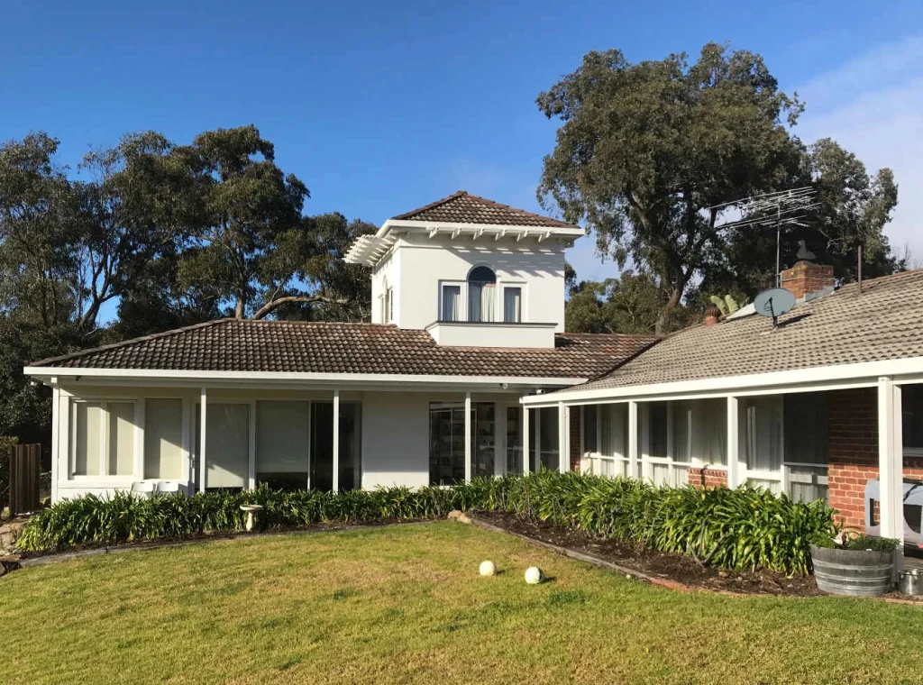 Rendered homestead and verandah