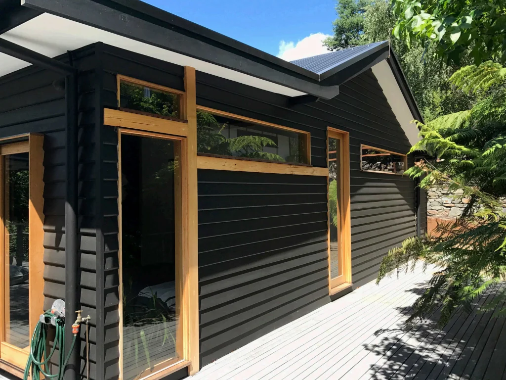 Charcoal weatherboards, timber frames