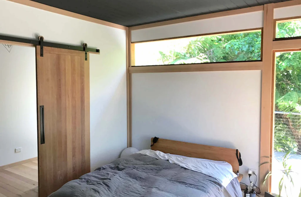 Bedroom with timber barn door